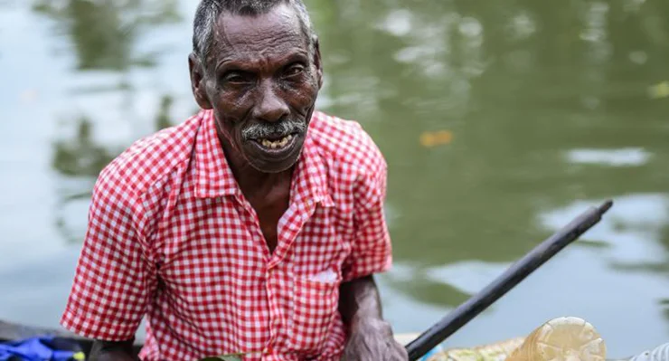 Aiding Rajappan in his Attempt to Keep Vembanadu Clean