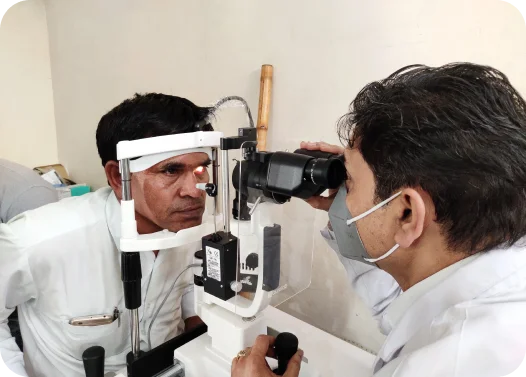 An optometrist conducting an eye examination using specialized equipment.